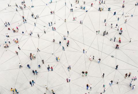 Individuals walking in different directions as seen from above